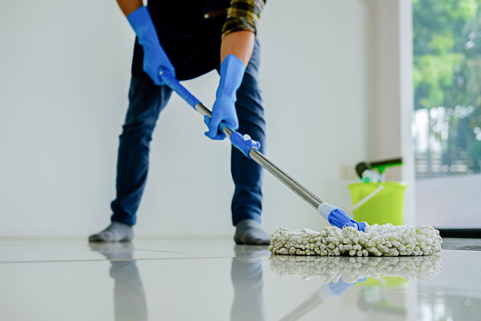low-section-woman-moping-floor-home | Spiffy Clean - Commercial & Office Cleaning Services | Spiffy Clean - Commercial & Office Cleaning Services